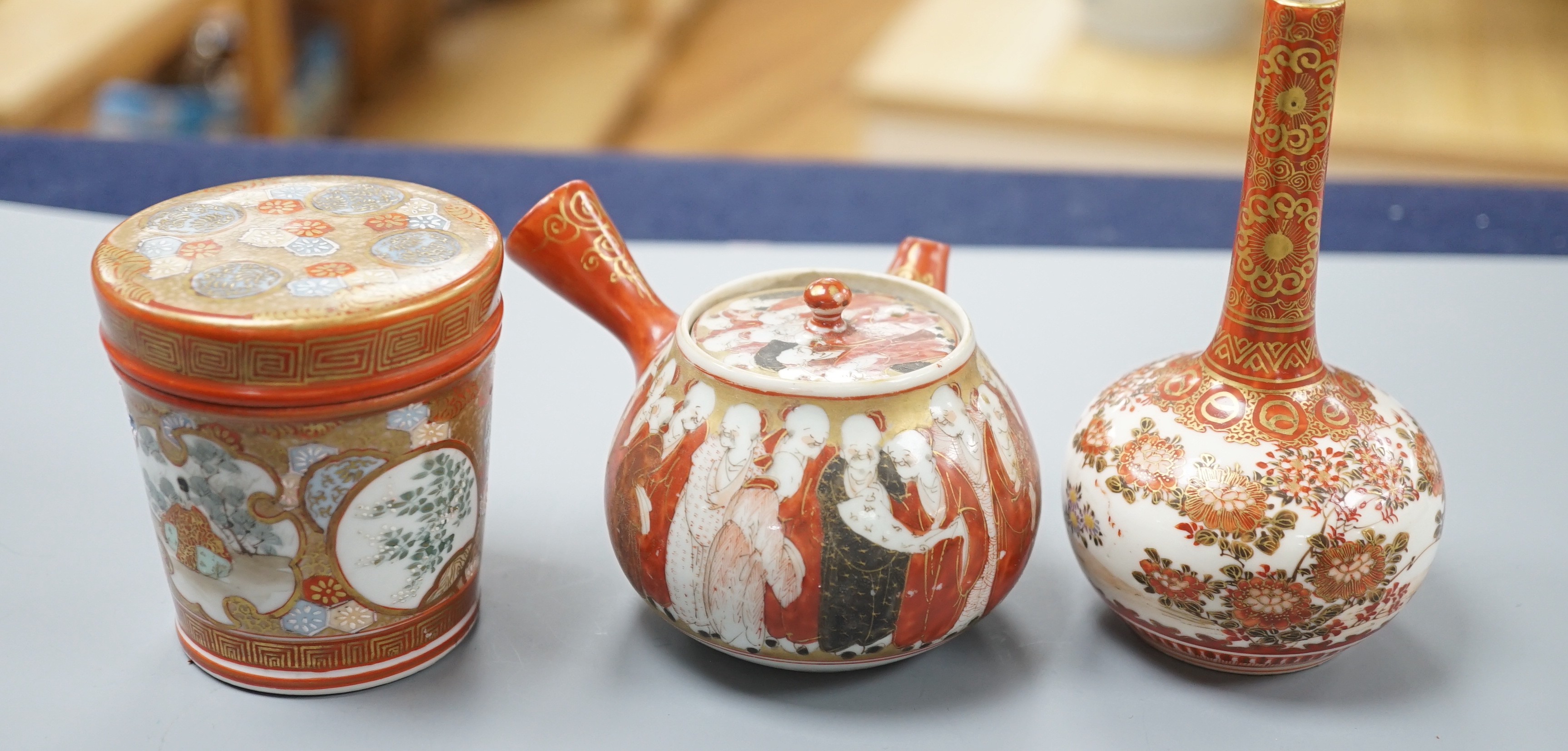 A group of Japanese small or miniature Kutani and Imari vessels and three Satsuma pottery mounted brooches, largest 11.7cm